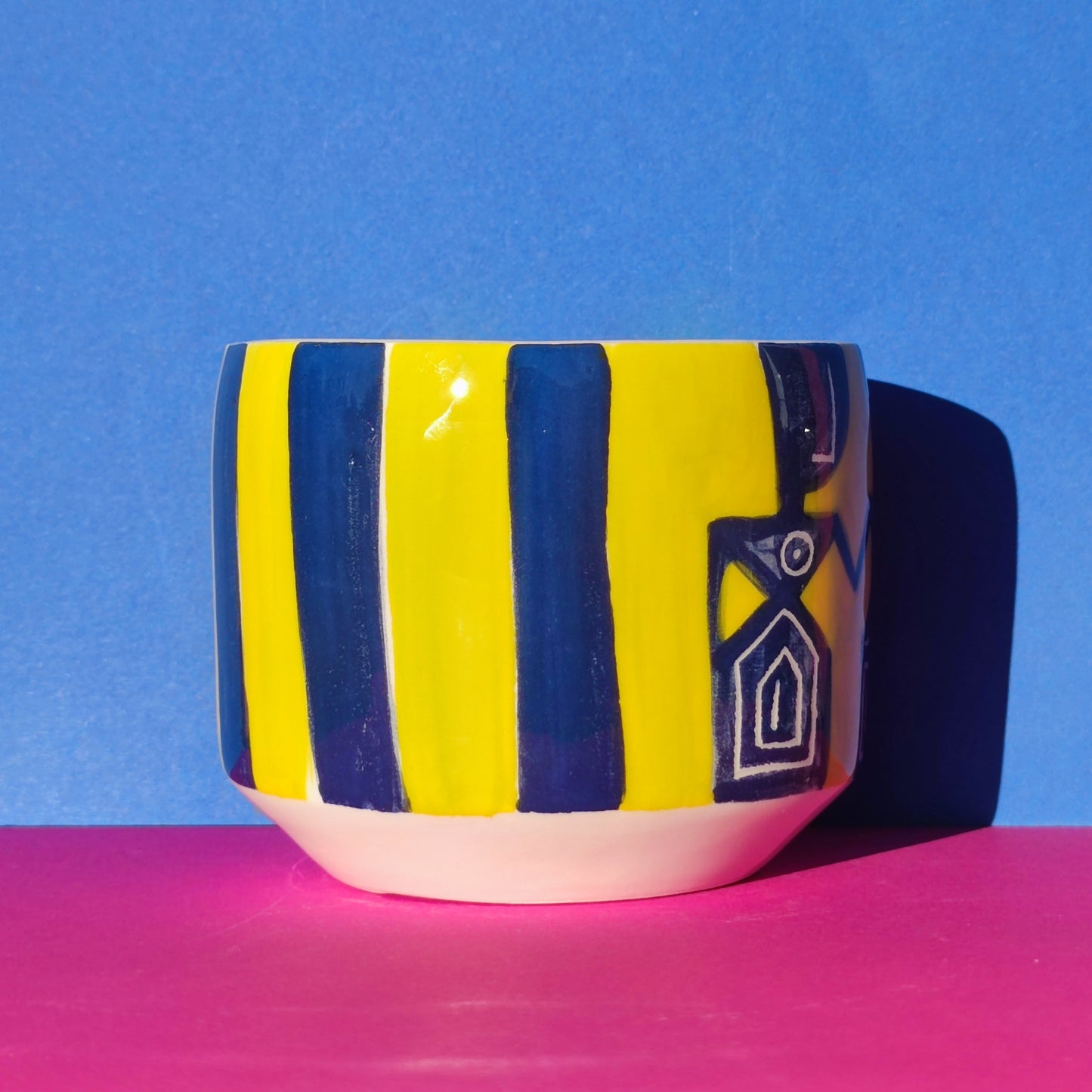 Colorful cappuccino cup in blue-lime